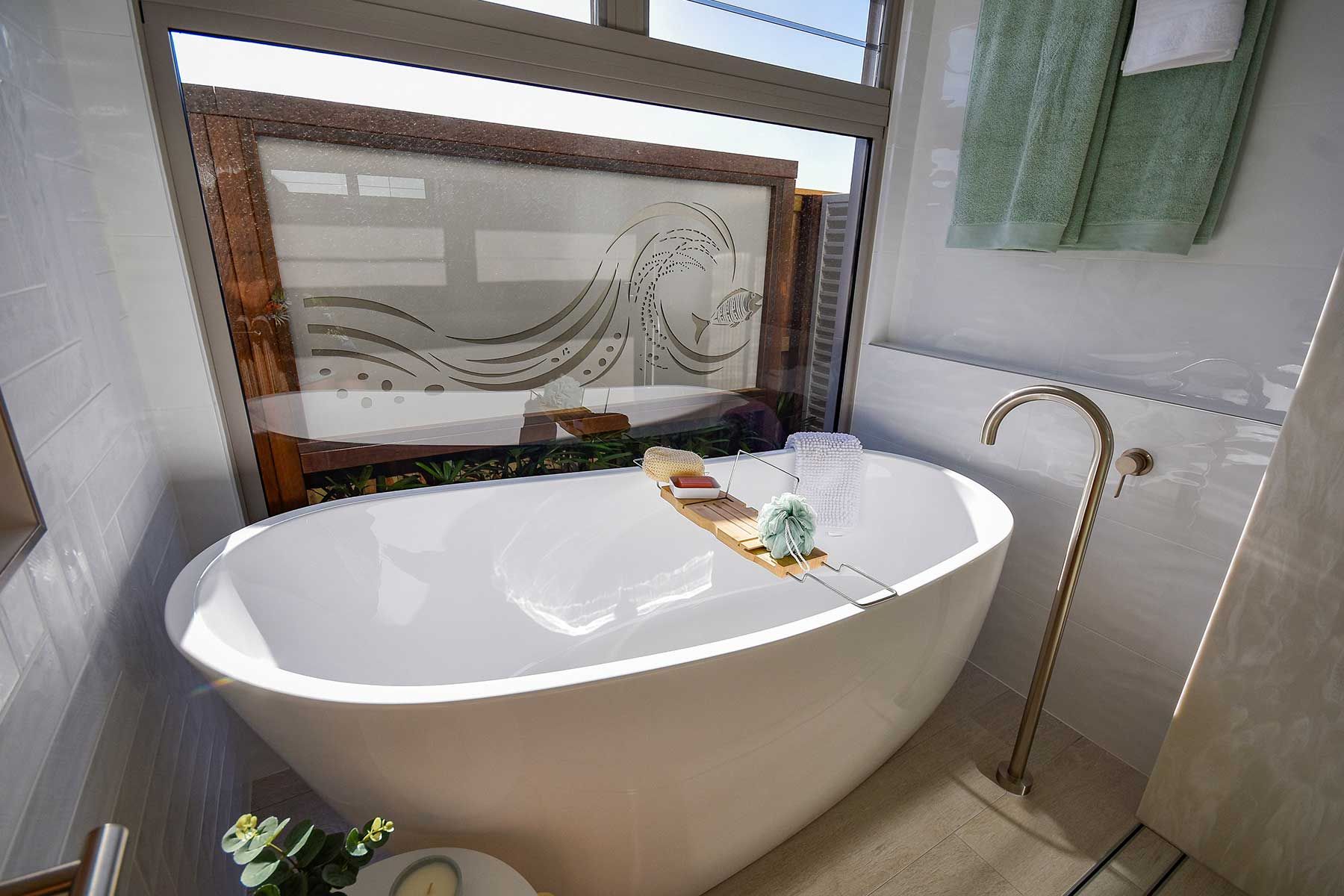 Modern Bathroom with A White Freestanding Bathtub — Bundy Homes in Bundaberg North, QLD