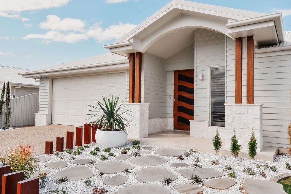 Modern Single-Story White House with A Front Porch — Bundy Homes in Bundaberg North, QLD