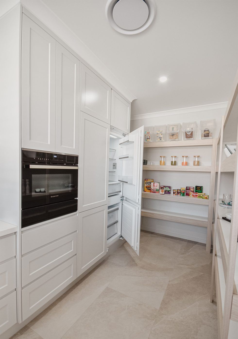 Bright White Modern Kitchen with Built-In Ovens — Bundy Homes in Bundaberg North, QLD