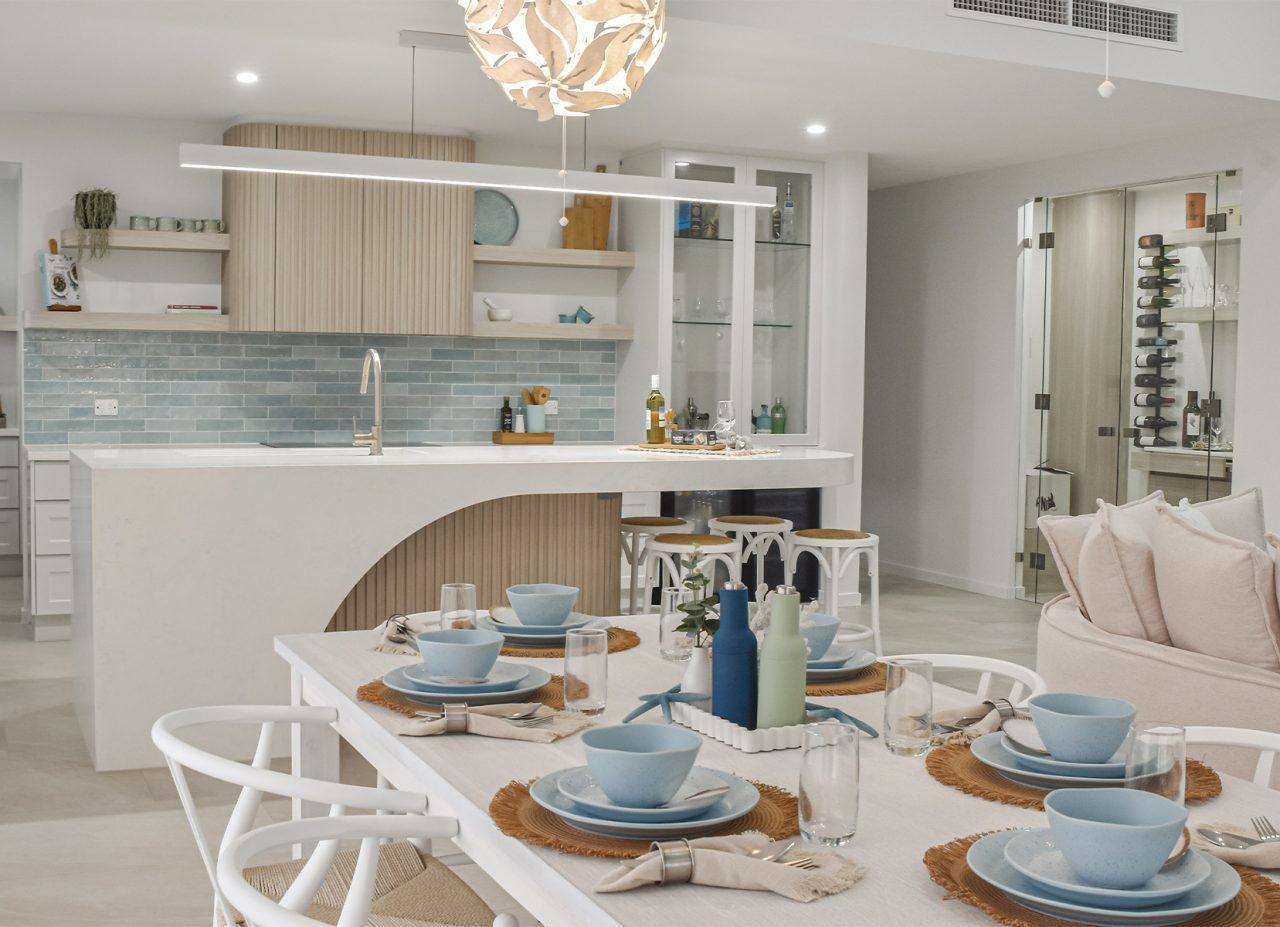 Bright Modern Kitchen and Dining Area with A Set Table — Bundy Homes in Bundaberg North, QLD