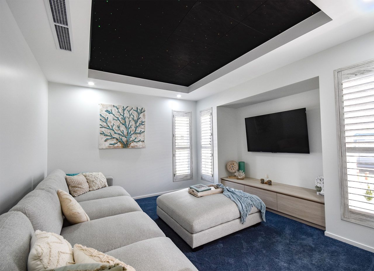 Bright Modern Living Room with White Sofa — Bundy Homes in Bundaberg North, QLD