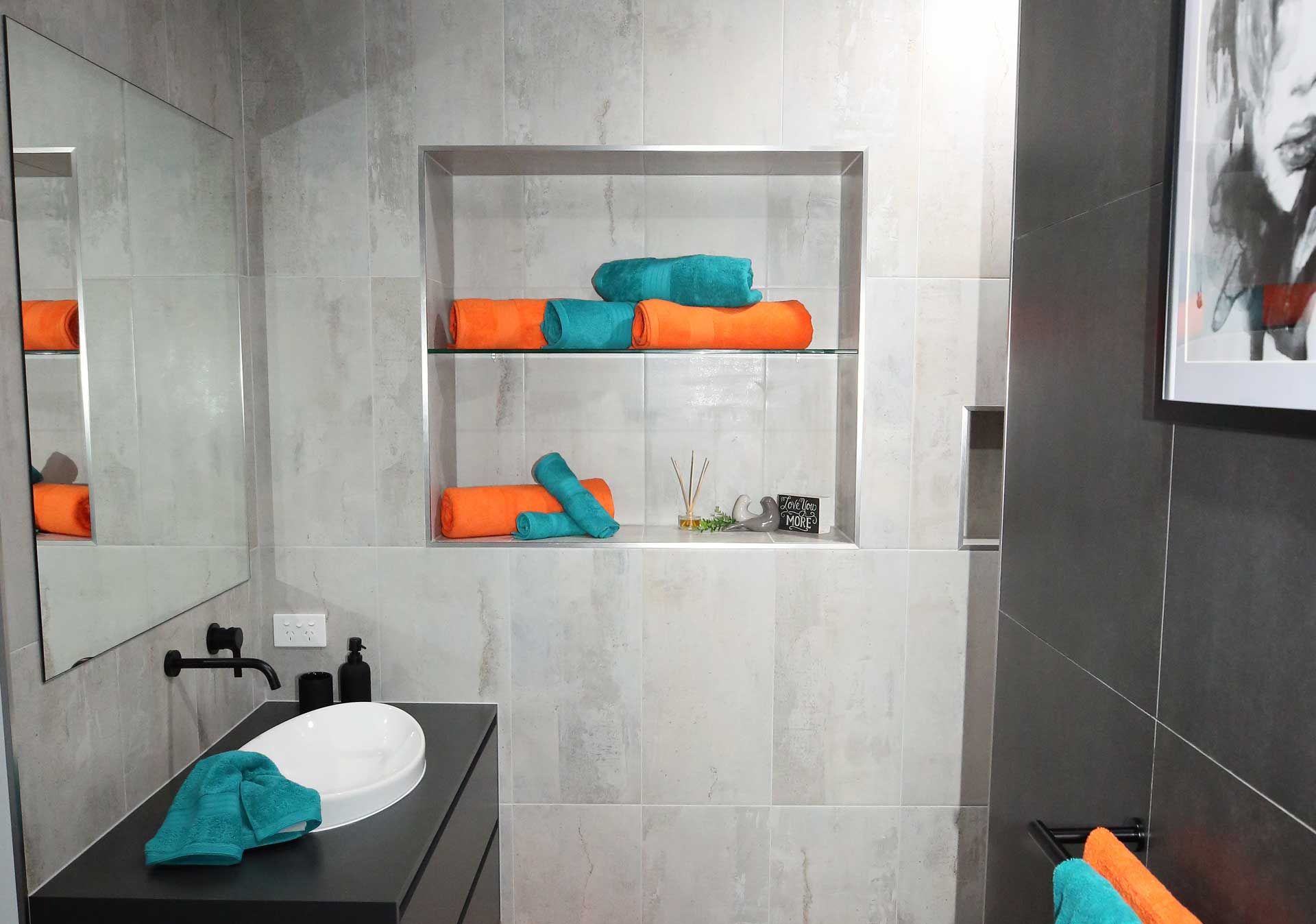Modern Gray Bathroom with Black Vanity — Bundy Homes in Bundaberg North, QLD