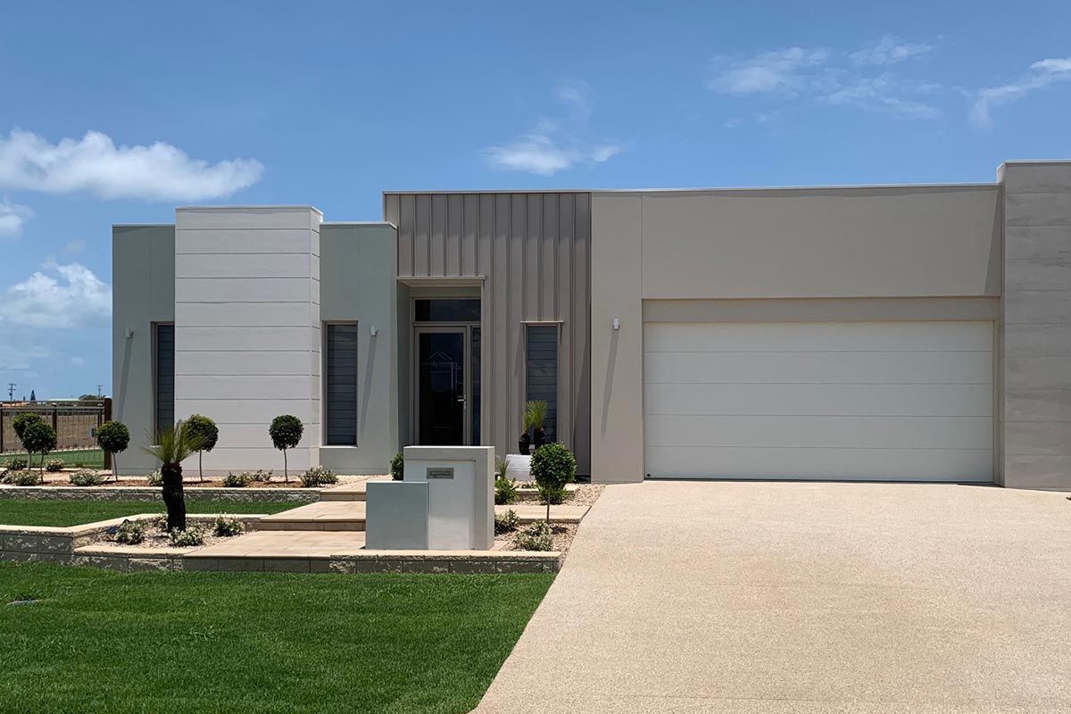 Modern Single-Story House Exterior with White Garage Door — Bundy Homes in Bundaberg North, QLD