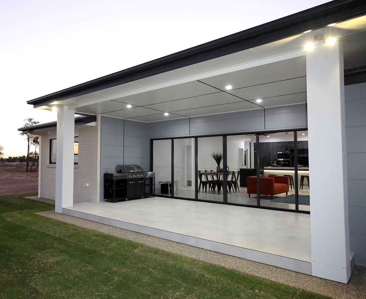 Modern Outdoor Patio with Sliding Glass Doors — Bundy Homes in Bundaberg North, QLD