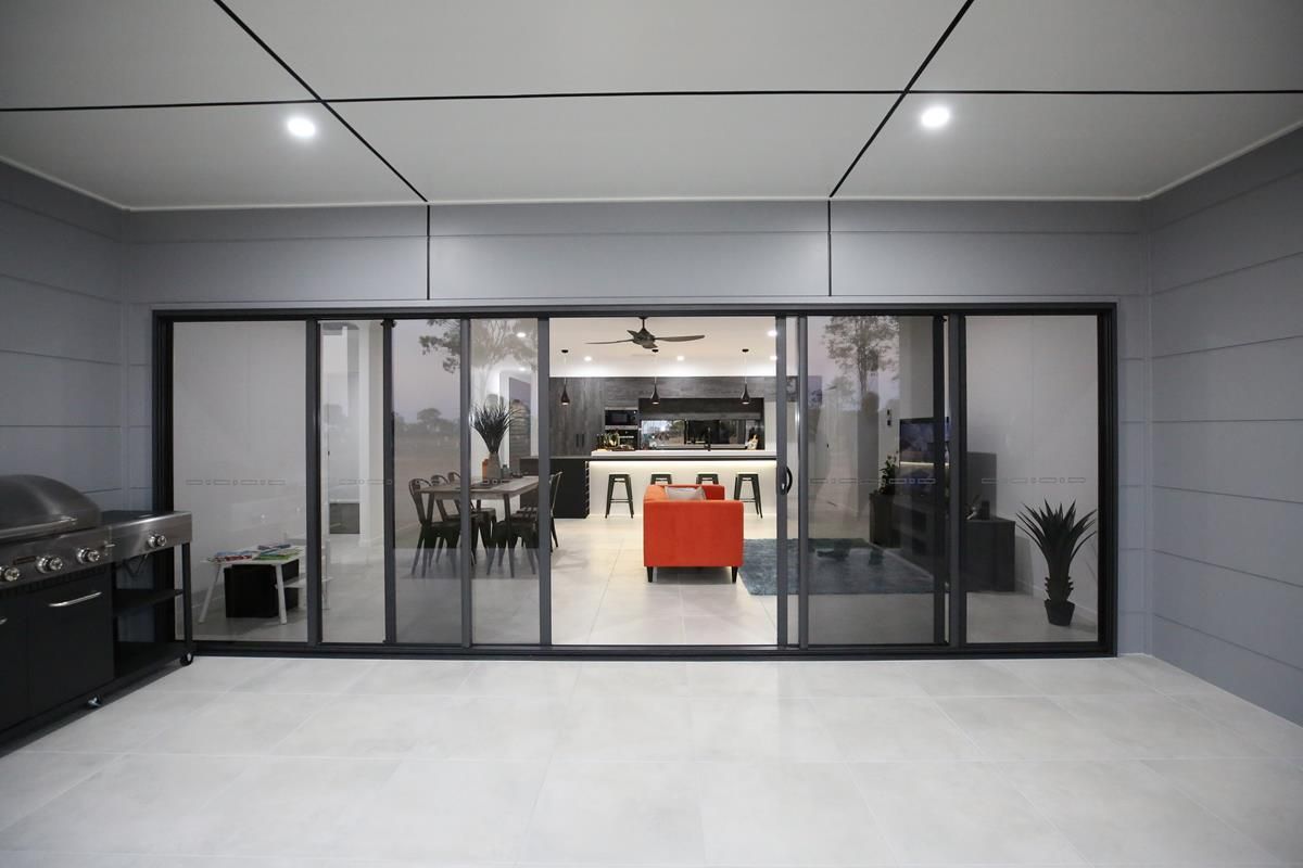 Modern Kitchen Viewed Through Glass Doors — Bundy Homes in Bundaberg North, QLD