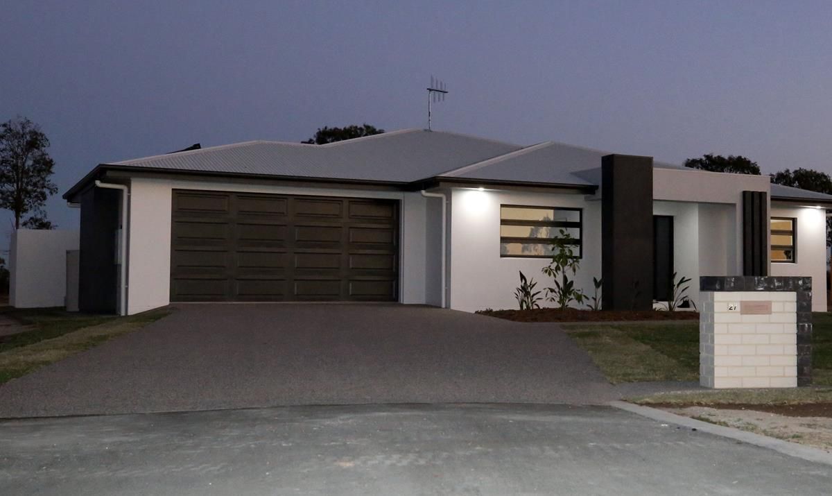 Modern Single-Story House at Dusk with A Lit Entryway — Bundy Homes in Bundaberg North, QLD