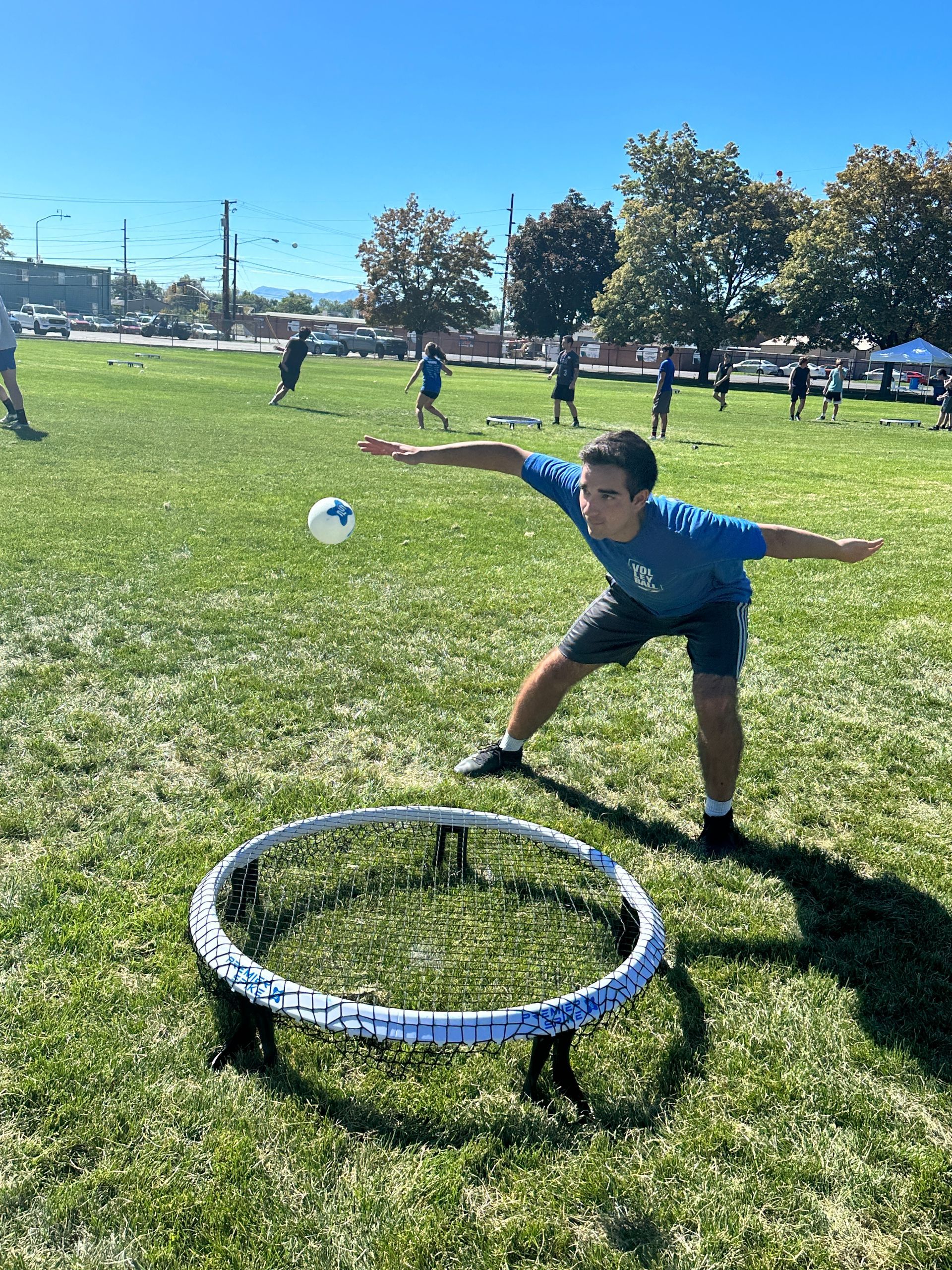 beginner spikeball player on premier spike set