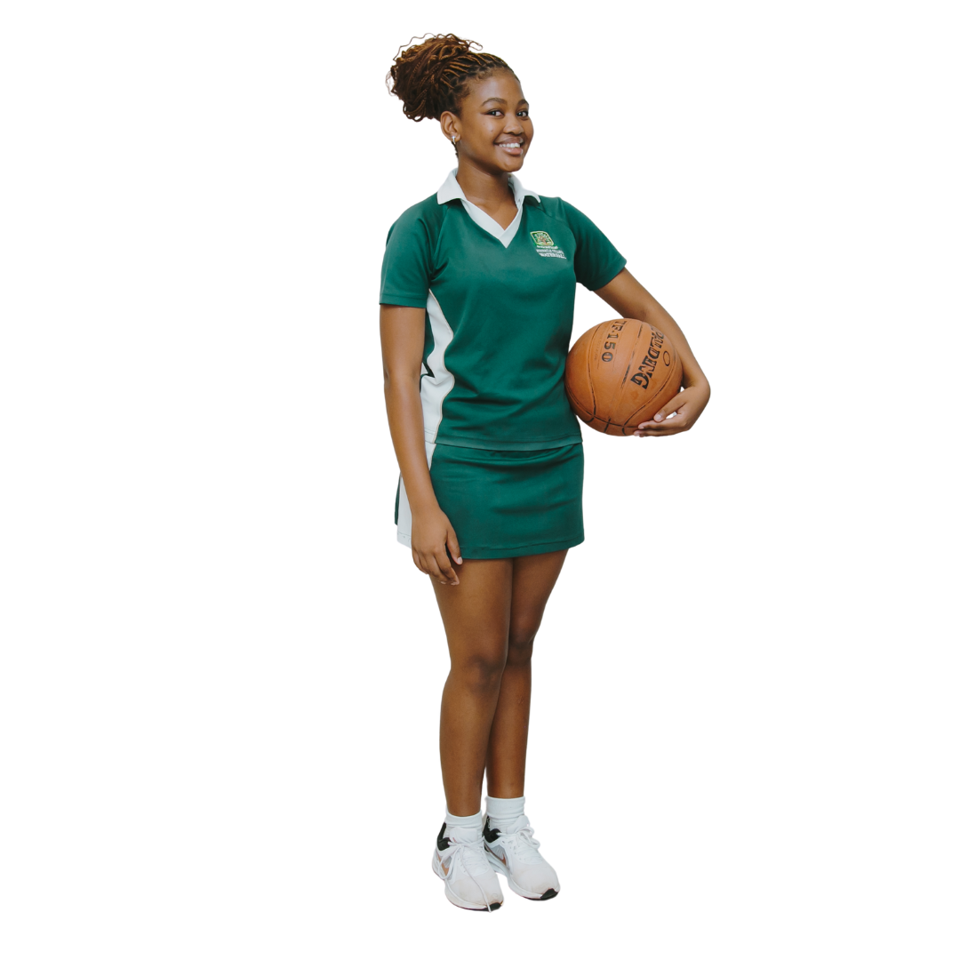 A woman in a green dress is holding a basketball