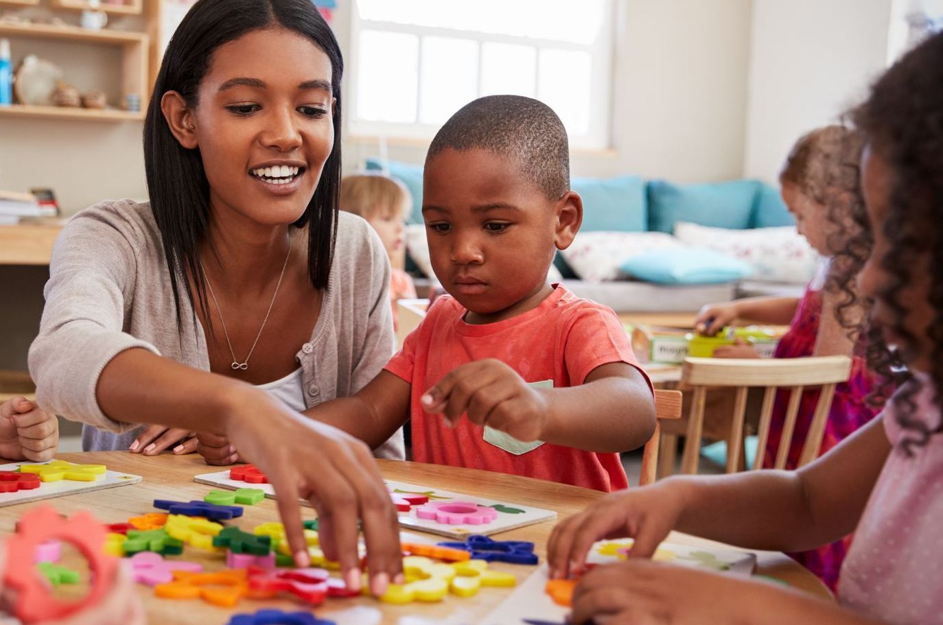 Students and guide in a Montessori classroom
