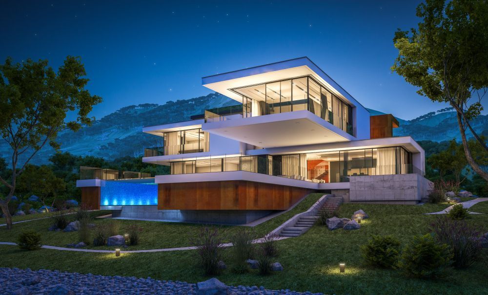 A Modern House with A Swimming Pool Is Sitting on Top of A Hill at Night — Croker Building Solutions In Myrtleville, NSW