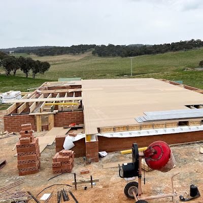 A house is being built in the middle of a field. — Croker Building Solutions In Myrtleville, NSW