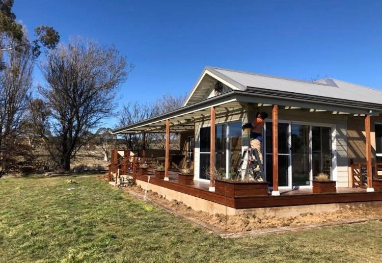 An Empty House with A Kitchen and Sliding Glass Doors — Croker Building Solutions In Myrtleville, NSW