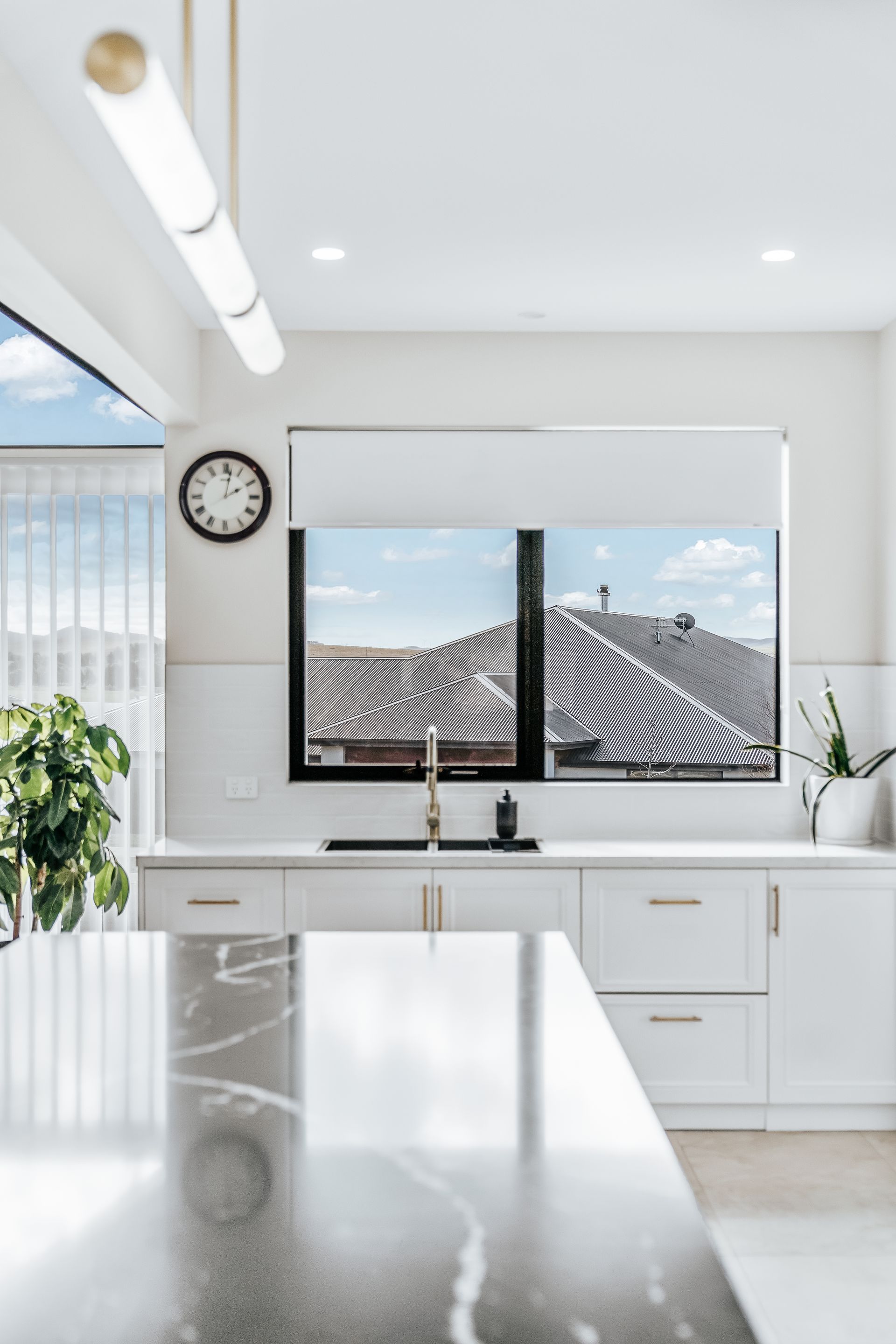 Bright White Kitchen With a Marble Countertop — Croker Building Solutions In Myrtleville, NSW