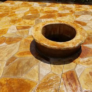 stamped concrete patio with firepit