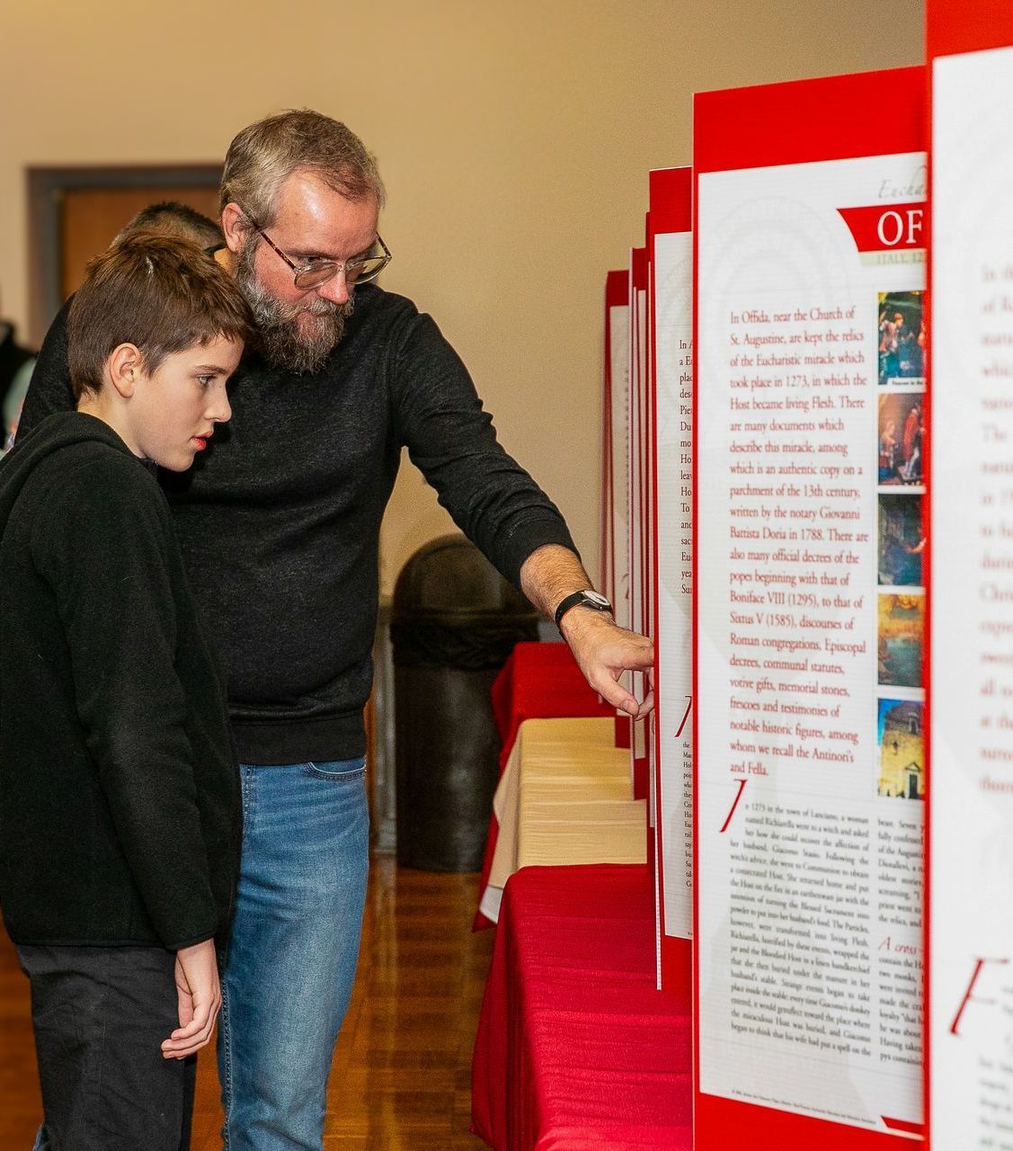 Father and son view an exhibit
