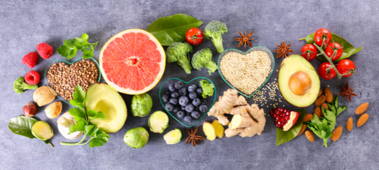 There are many different types of fruits and vegetables on the table.