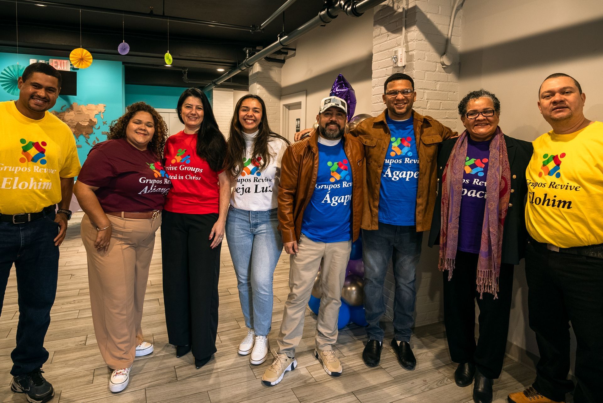 a group of people are posing for a picture
