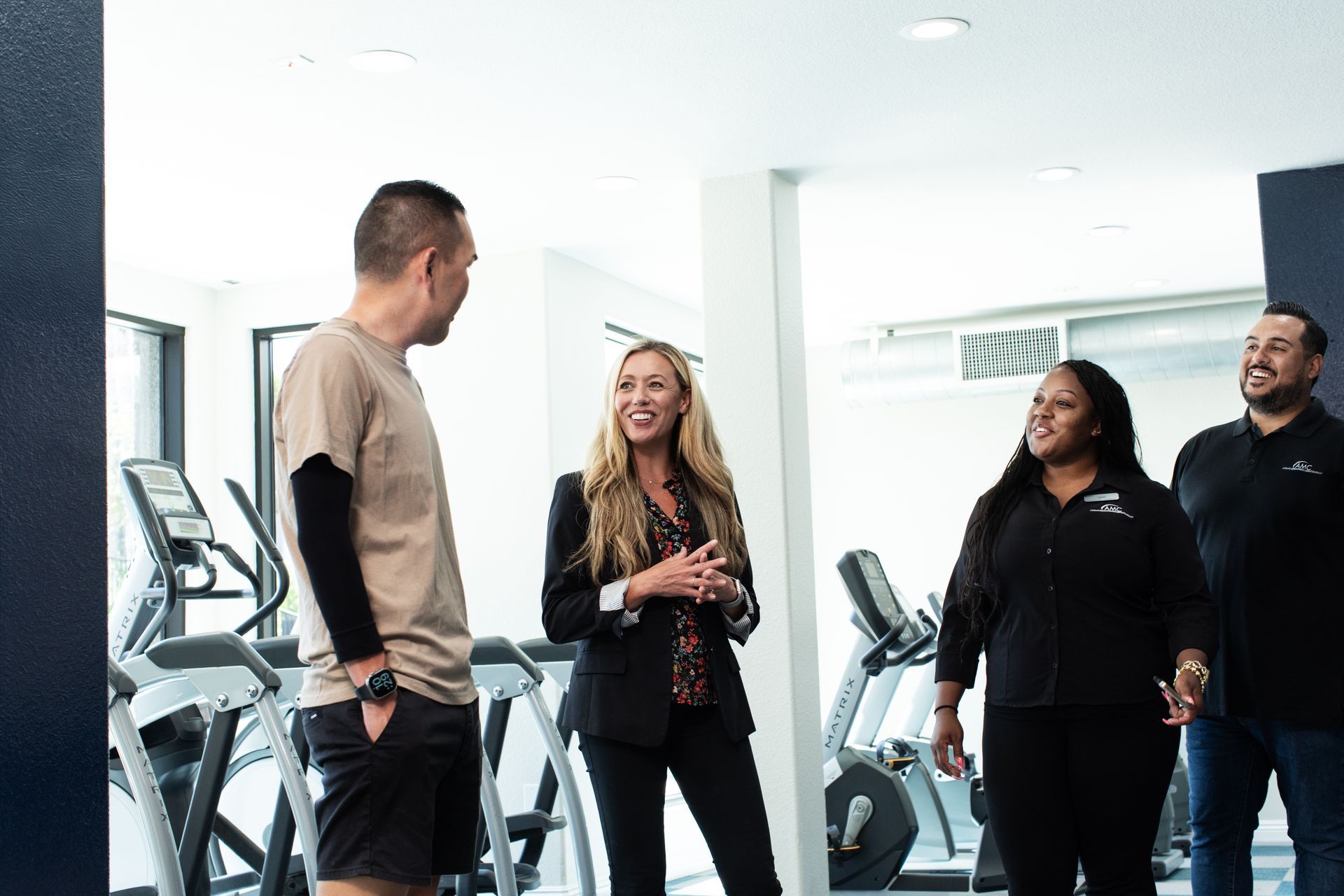 team members talking in fitness center