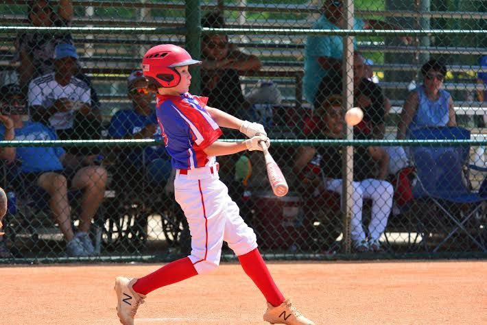 Baseball Player Hitting Ball