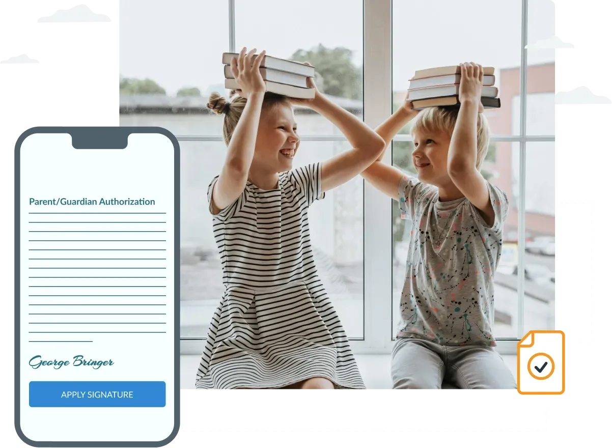 A boy and a girl are holding books over their heads.