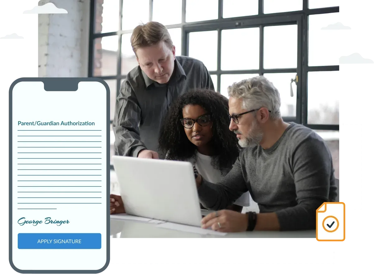 A group of people are looking at a laptop computer.