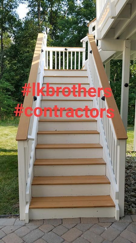Front staircase with white railings and tan steps, overlaid with red hashtag text