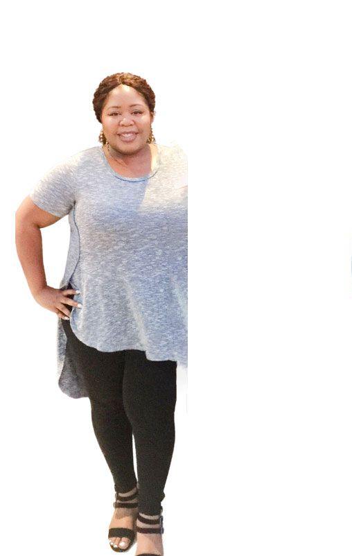 Woman in gray shirt and black pants poses, hand on hip.