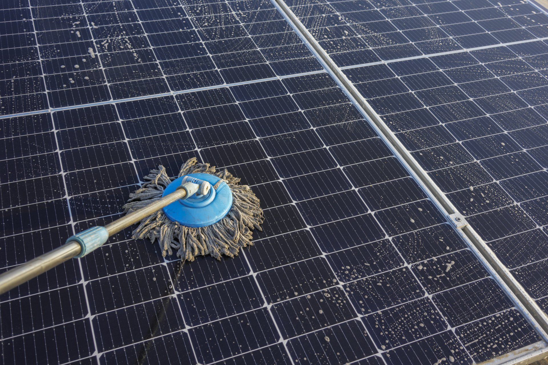 Man Cleaning Roof With Pressure Washing — Clanton, AL — Pristine Power Clean Man Cleaning Roof With Pressure Washing — Clanton, AL — Pristine Power Clean