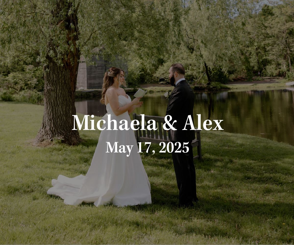 A bride and groom exchange vows outdoors by a pond in front of a tree, with the text