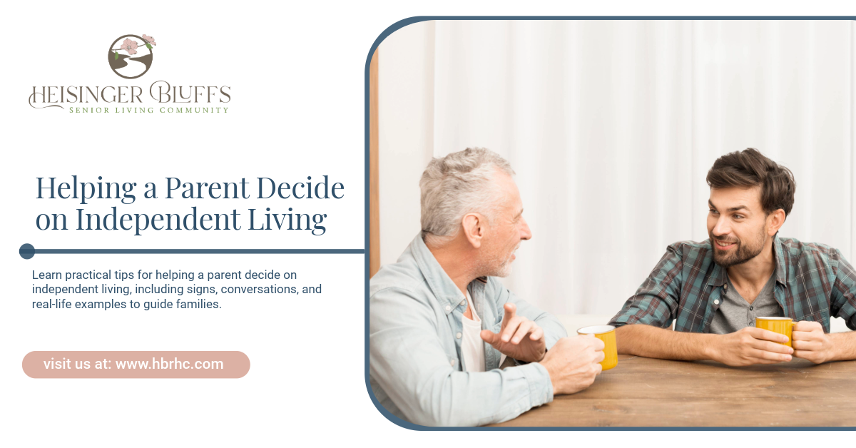 An adult and his senior dad sitting on a table, drinking a cup of coffee, talking about independent living
