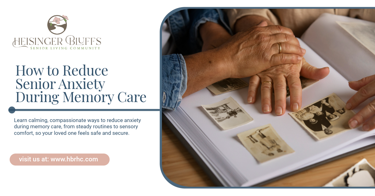 A caregiver holding the hands of a memory care resident while looking at old photos