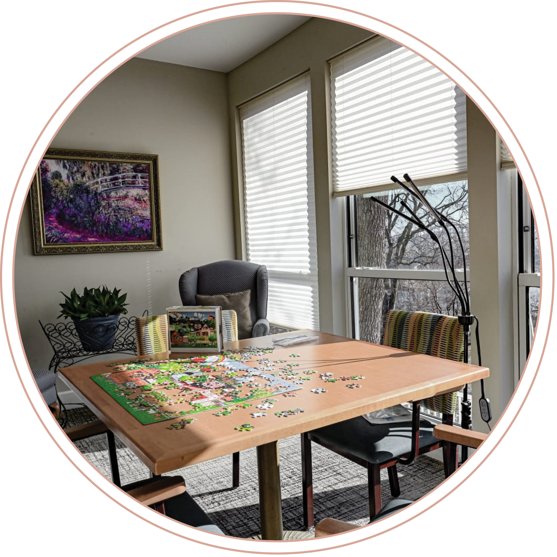 A table with a puzzle on it in a living room at a local Long Term Care Facility