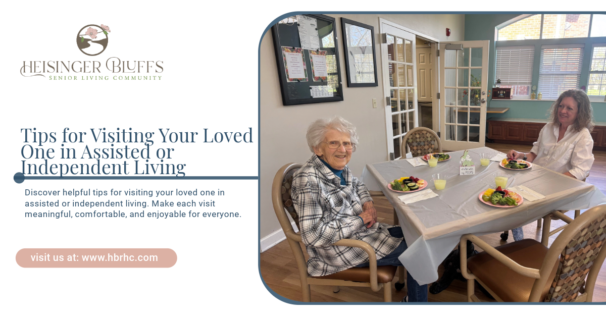 Two elderly women are sitting at a table with plates of food.