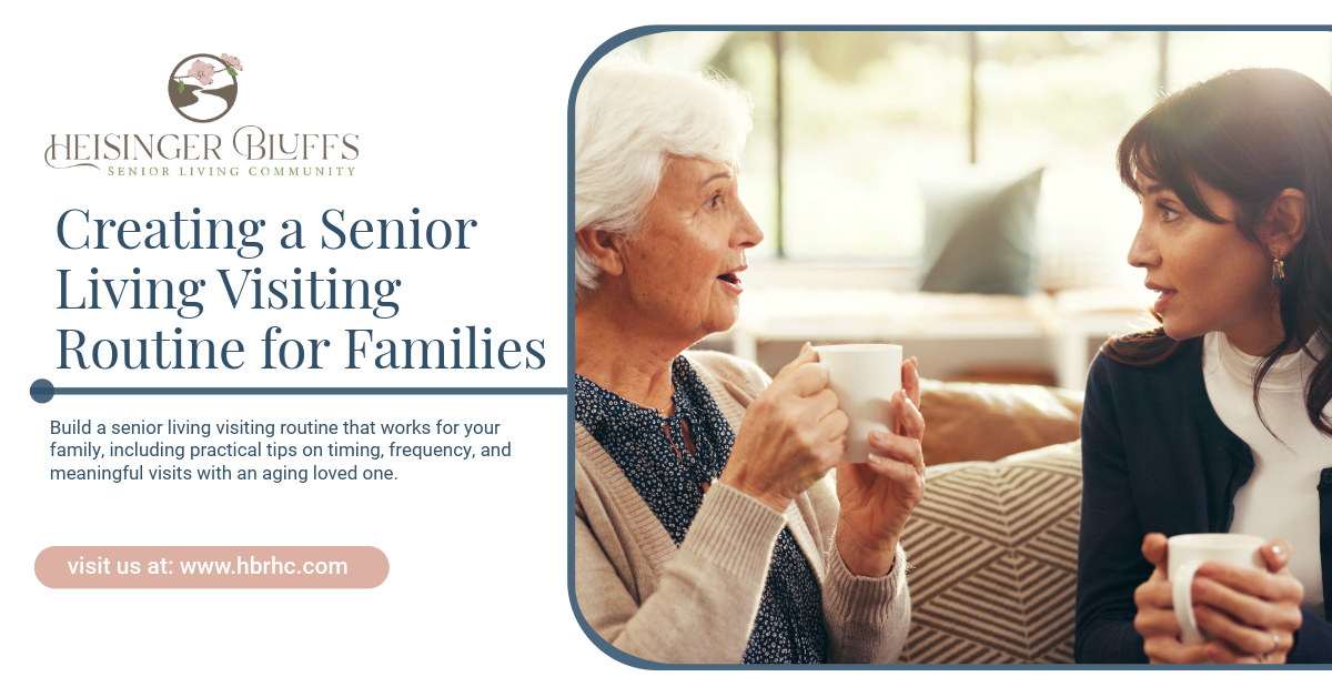 A daughter talking to her senior mother while they're both drinking a cup of tea on a couch