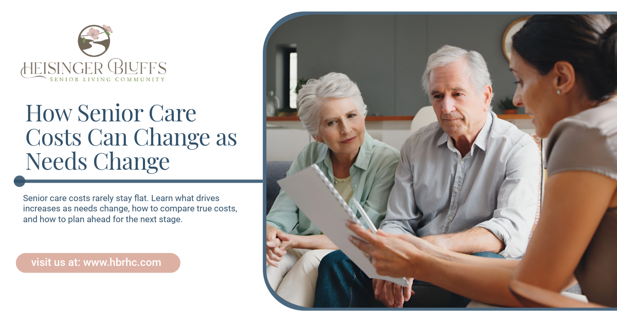 A senior caregiver talking to an elderly couple abour care plans