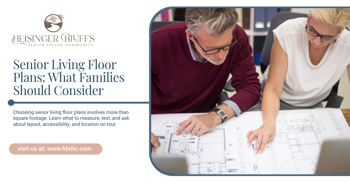 A senior couple looking at a senior living community floor plan