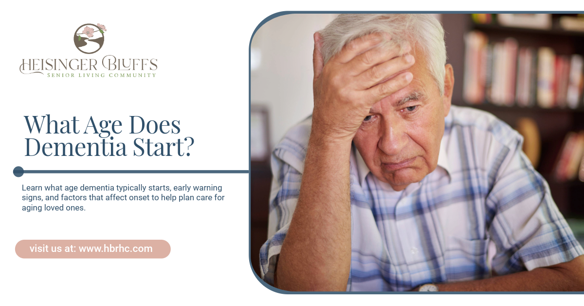 A senior with dementia is holding his head, looking concerned.