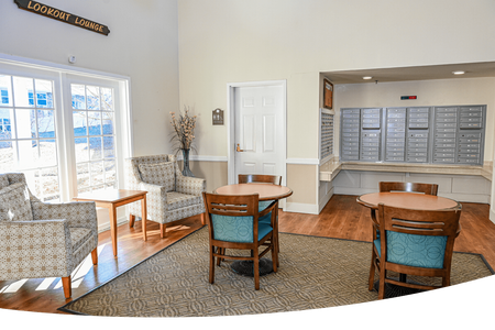 Independent Living: Embrace Freedom and Independence: Premium Independent Living in Jefferson City at Heisinger Bluffs. An elderly couple sitting at a table playing a game of puzzles