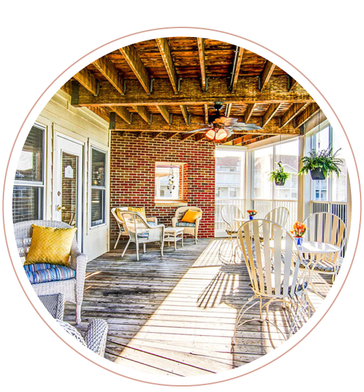A porch with furniture at a local nursing home facility that has life plans for seniors looking for assisted living or independent living, and more
