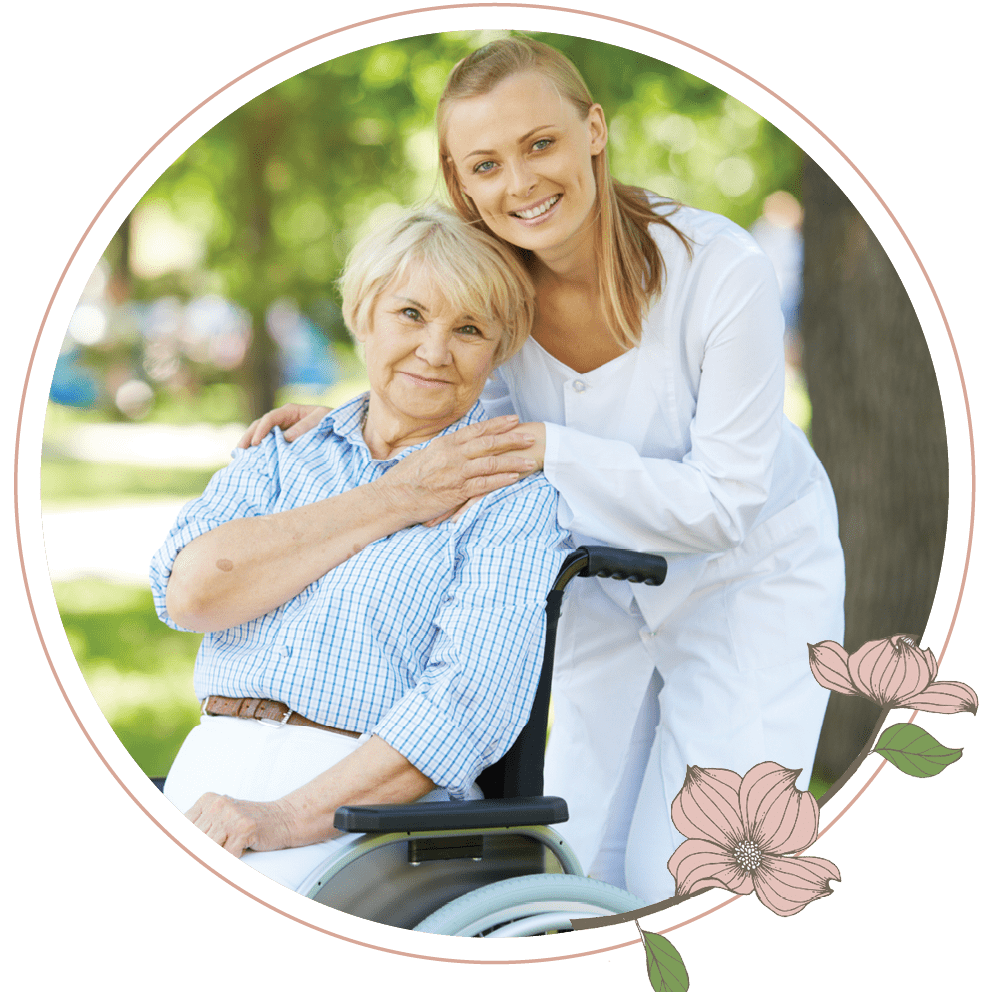 A woman standing next to an older woman in a wheelchair