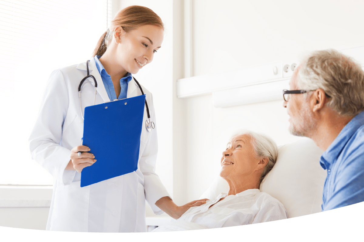 A doctor talking to a patient in a hospital bed