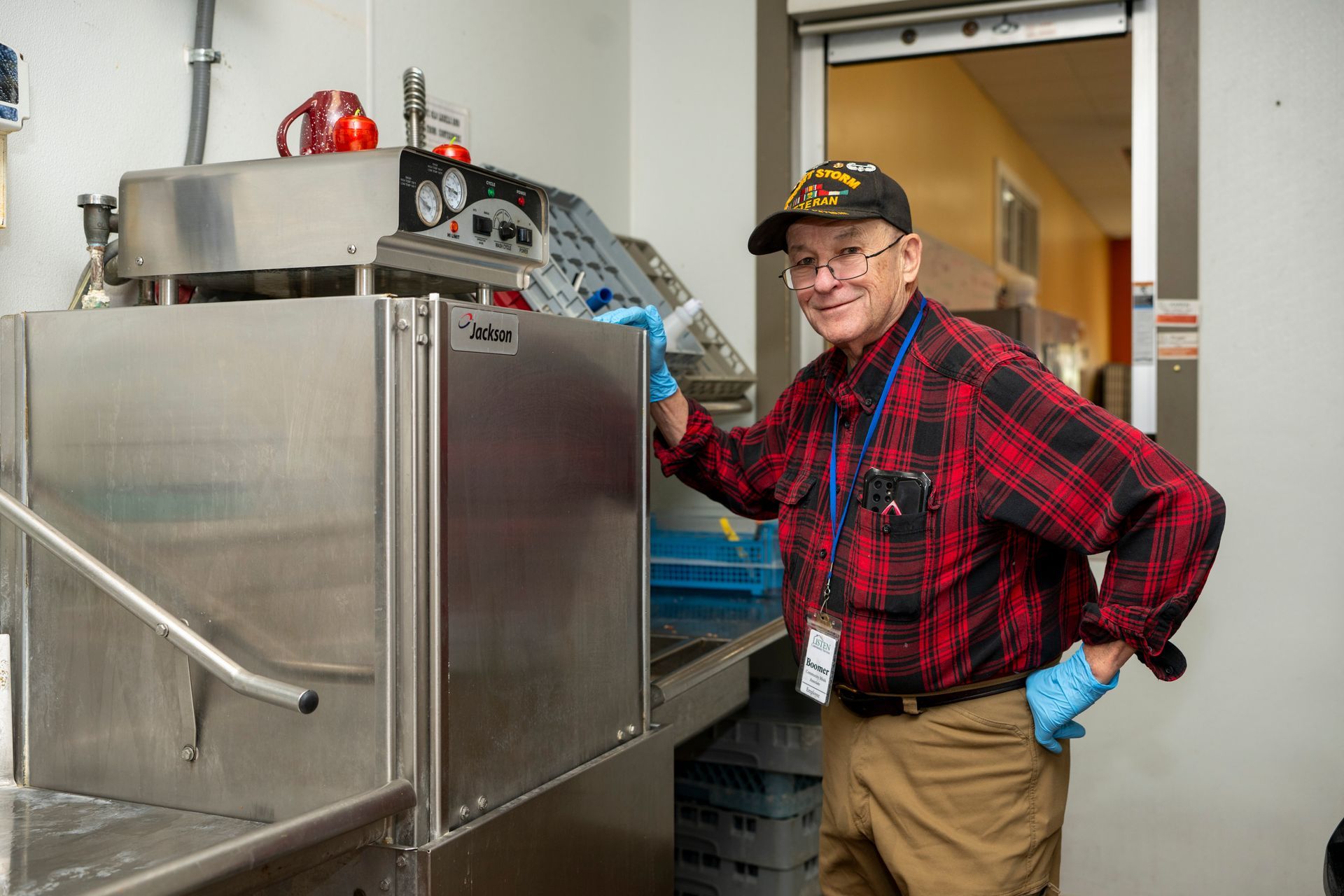 Volunteer helping in the community dining hall