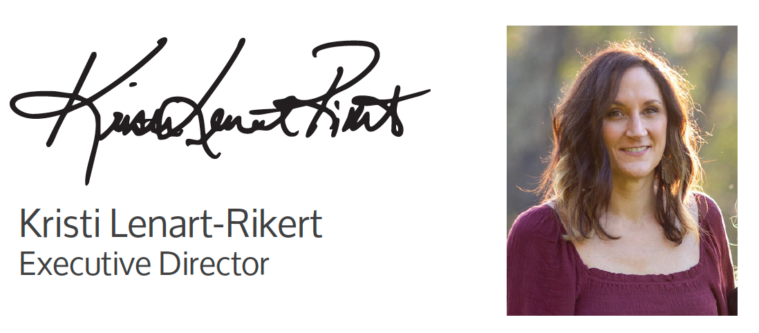 A picture of a woman next to a sign that says kristi lenart-rikert executive director