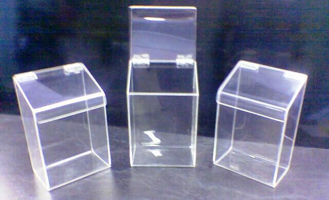 Three clear acrylic boxes are sitting on a table - Engineering Tooling In Thornton, NSW