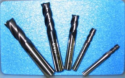 A bunch of drill bits on a blue surface - Engineering Tooling In Thornton, NSW