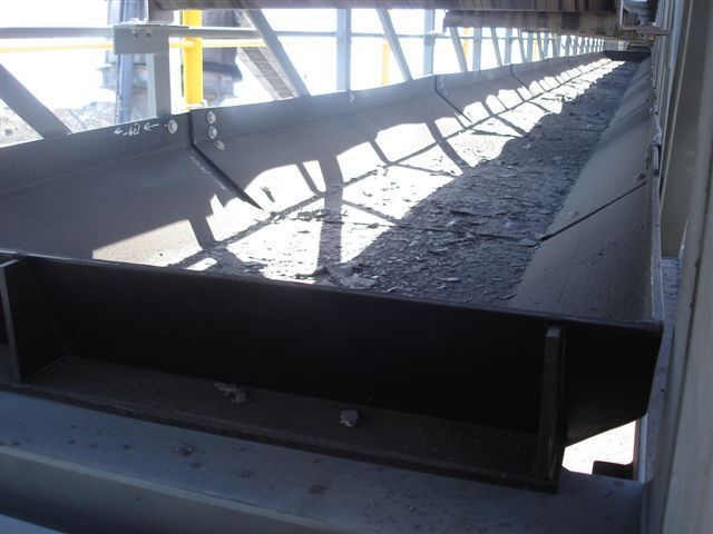 A conveyor belt with a lot of dirt on it - Engineering Tooling In Thornton, NSW