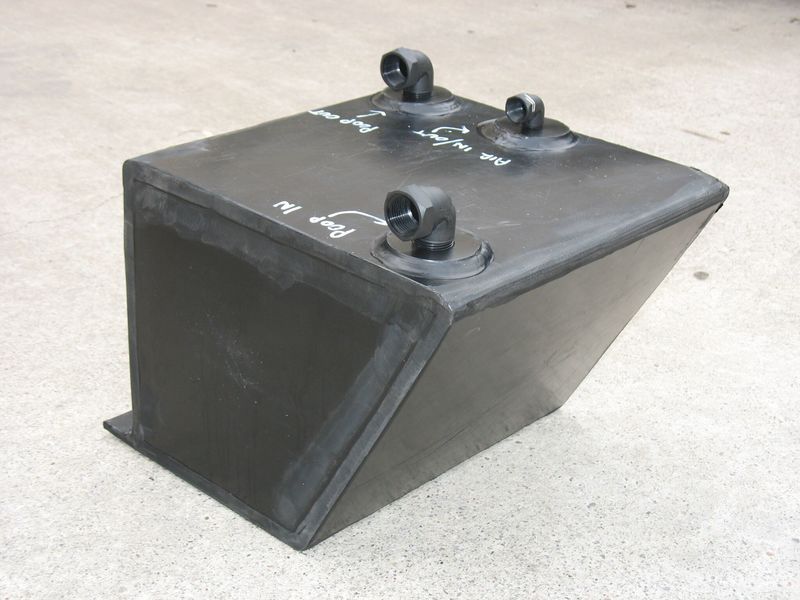 A black plastic container with wheels is sitting on a concrete surface - Engineering Tooling In Thornton, NSW