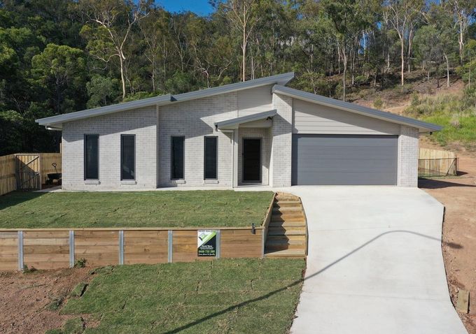 A Bathroom With Two Sinks and a Walk in Shower — Werry Building Services in Boyne Island, QLD