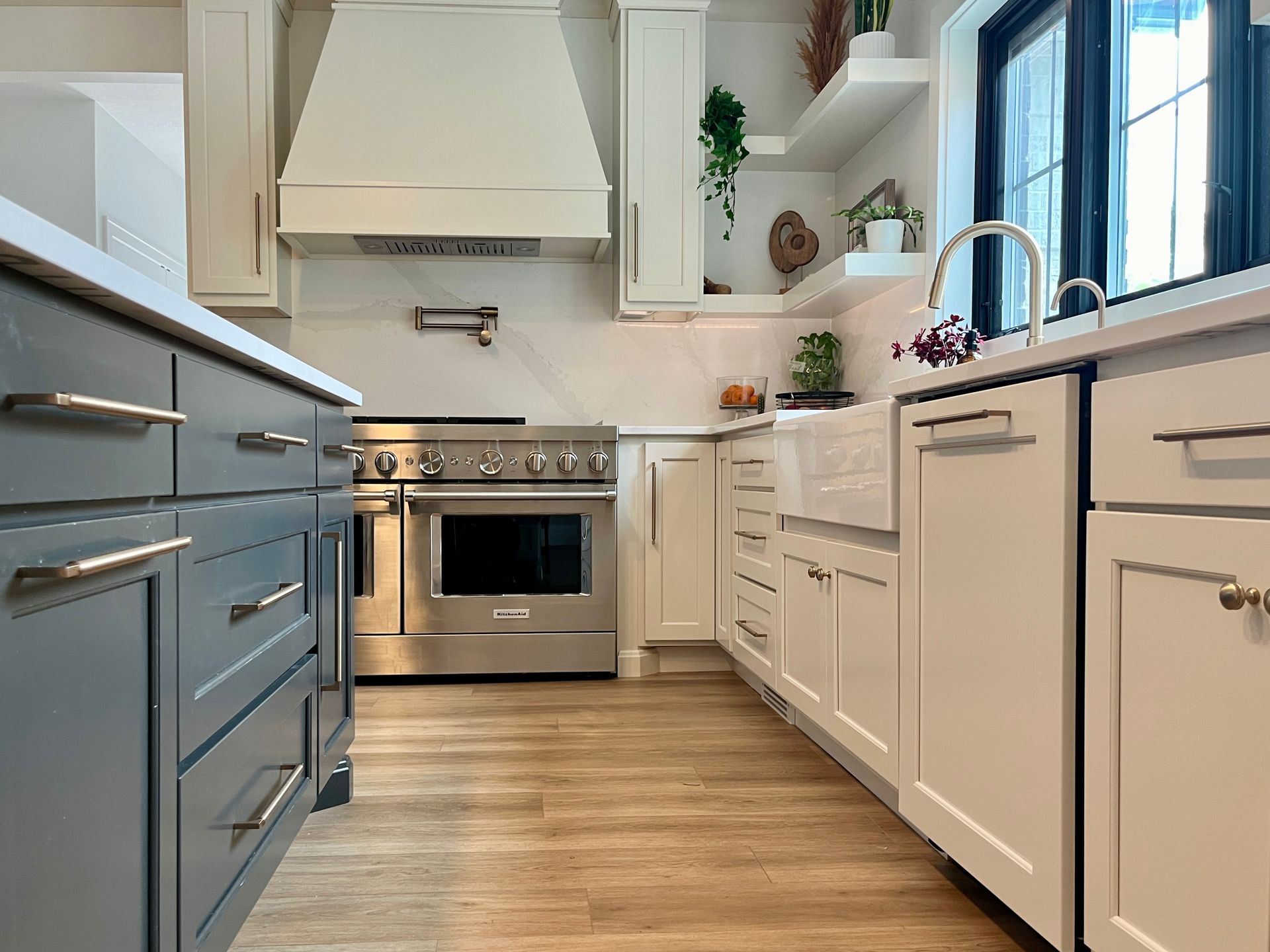 Oven stove, dishwasher, and island table with cabinets,