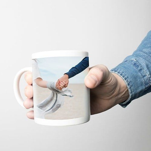 Hand holding a mug